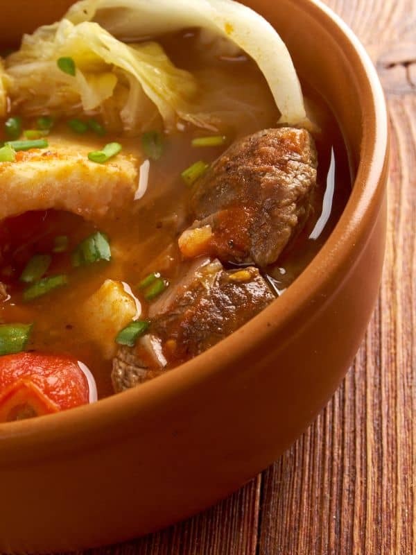 old-fashioned oxtail soup recipe in a clay bowl