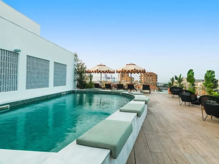 rooftop pool with lounge area at H10 Croma Málaga, one of the best hotels in Malaga centre