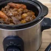 oxtail casserole made in the slow cooker with carrots ready to be served