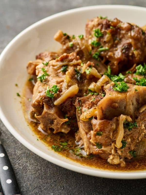 spicy oxtail recipe served in a white plate