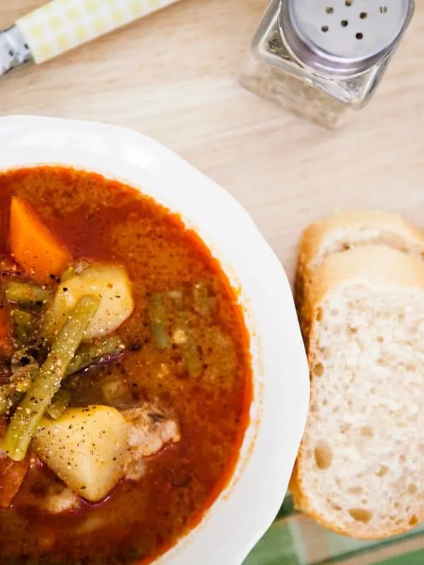 tomato oxtail soup served with 2 slices of bread