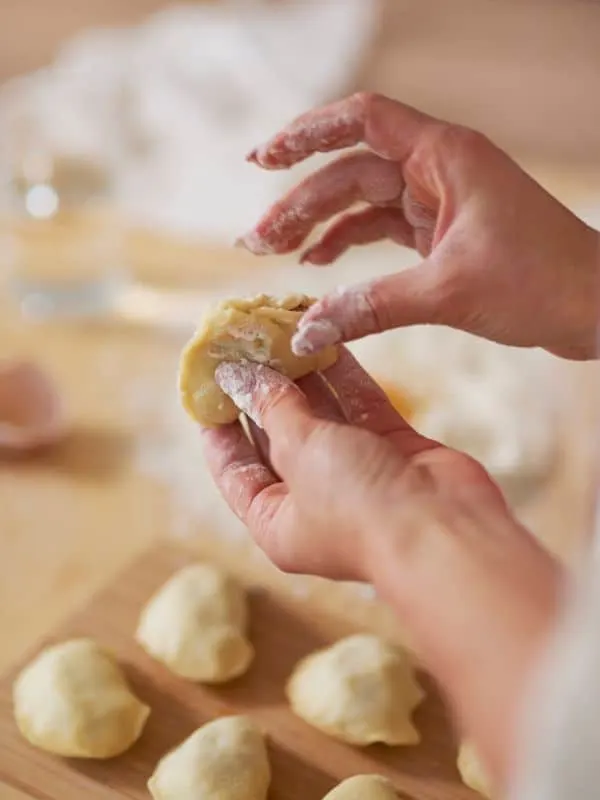 woman making oxtail dumplings