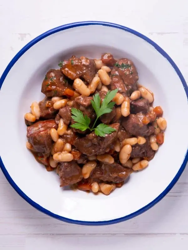 a bowl of oxtail and butter beans stew