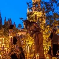 easter week in seville being celebrated on the streets, what is the history of semana santa