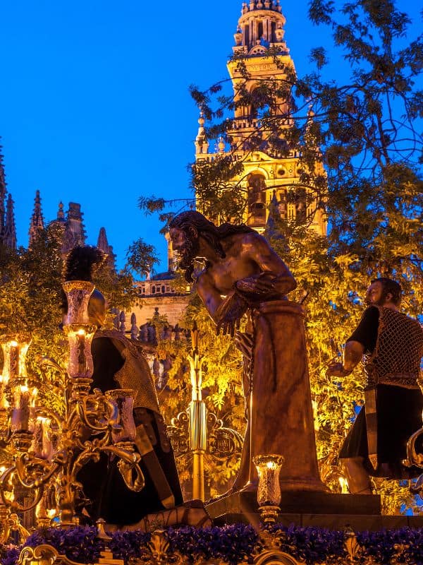 easter week in seville being celebrated on the streets, what is the history of semana santa