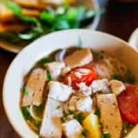 best fish soup recipe in the world with potatoes and other vegetables in a bowl.