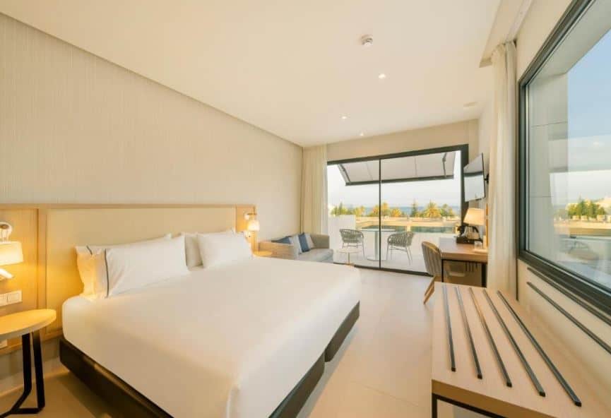 bedroom with desk and terrace with seaview at Eurostars Oasis Marbella, Malaga