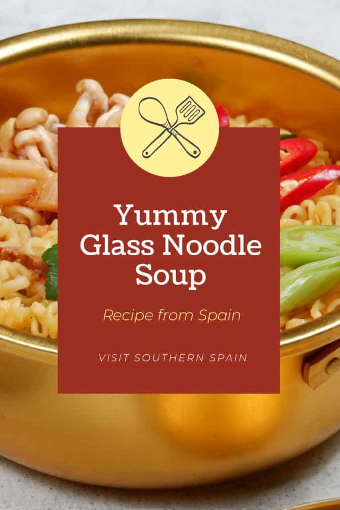 a pin with a closeup of a glass noodle soup with vegetables.