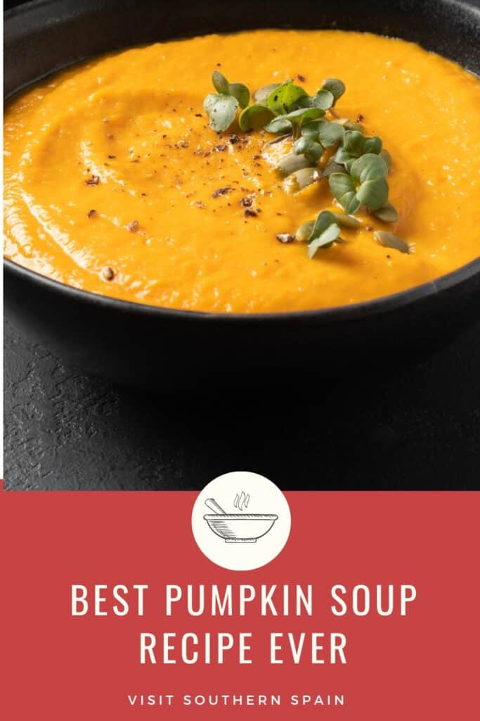 a pin with the Best Pumpkin Soup Recipe Ever in a black bowl.