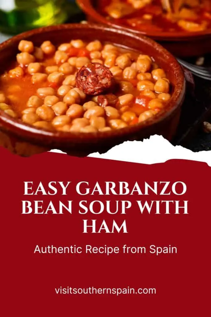 a pin with a garbanzo bean soup with ham in a clay bowl.
