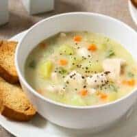 halibut soup in a bowl served with toast