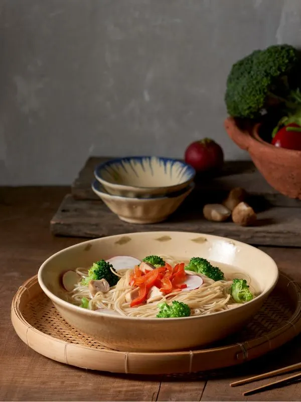 vegetable noodle soup with broccoli in a bowl