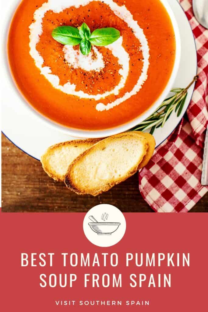 a pin with a tomato pumpkin soup from Spain in a bowl decorated with cream and served with toast.