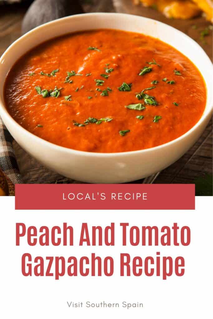 a pin with a peach and tomato gazpacho in a white bowl.