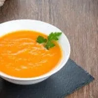 Spanish pumpkin soup without cream in a bowl on a black plate
