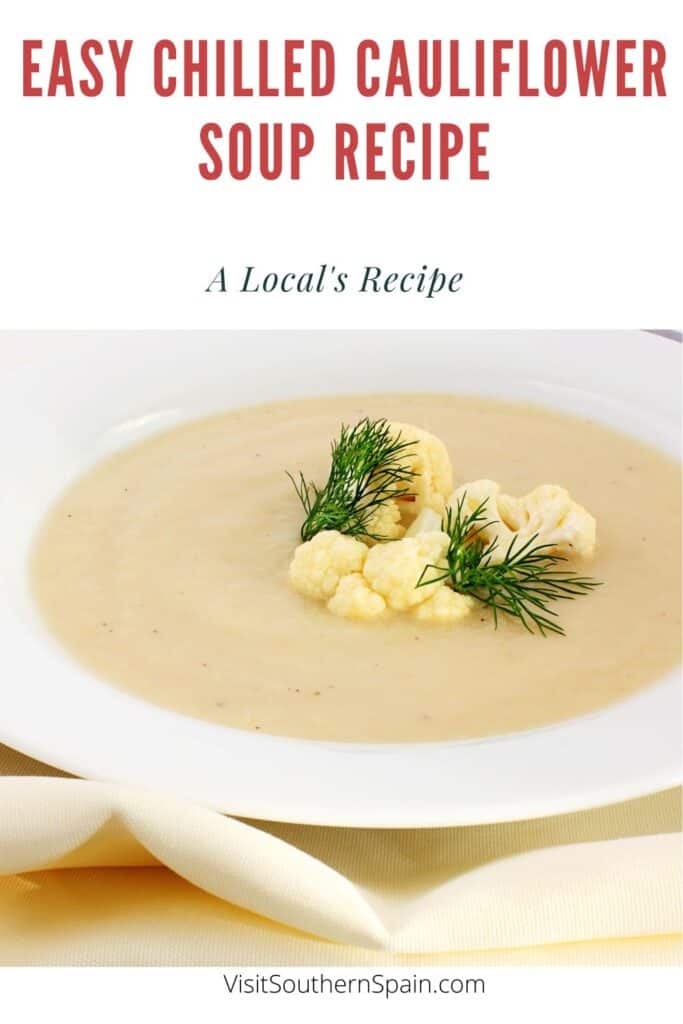 a pin with a Chilled Cauliflower Soup in a bowl decorated with cauliflower