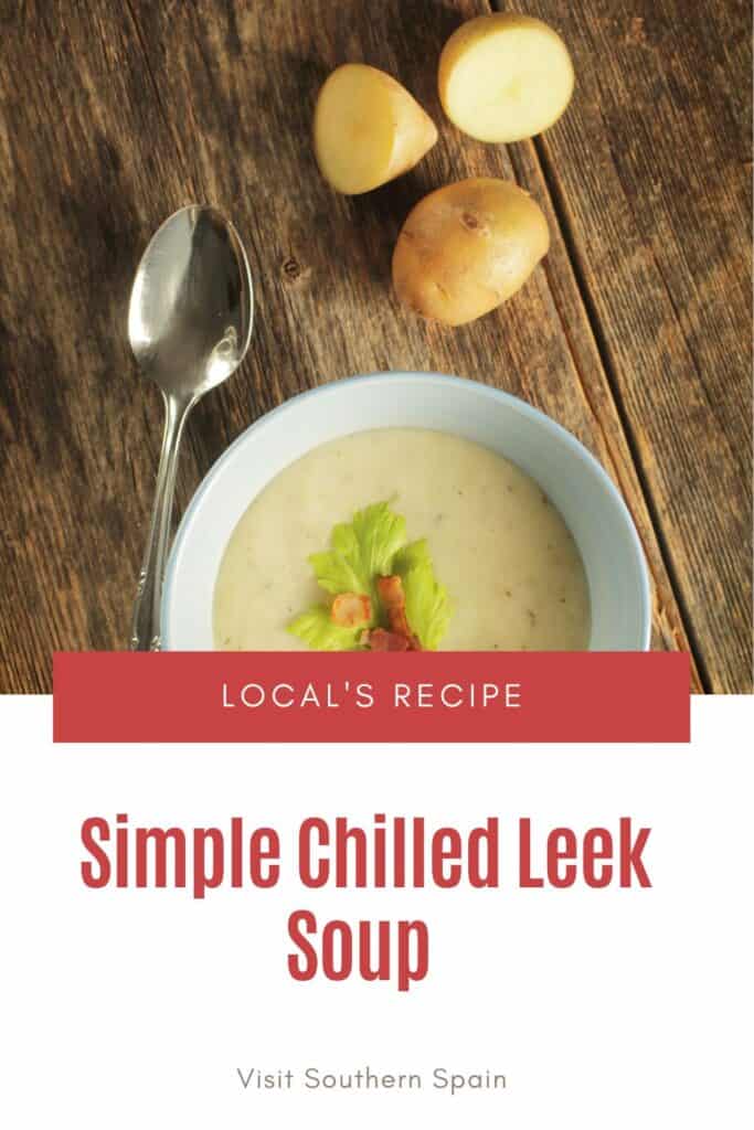 a pin with a bowl of Chilled Leek Soup on a wooden table.