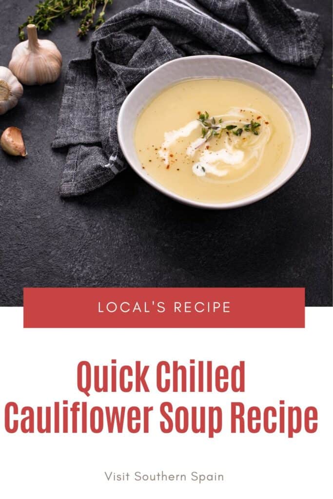 a pin with Chilled Cauliflower Soup in a bowl on a black surface.