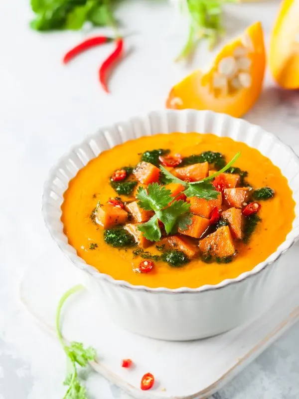 pumpkin and sweet potato soup from Spain in a bowl decorated with pieces of sweet potato