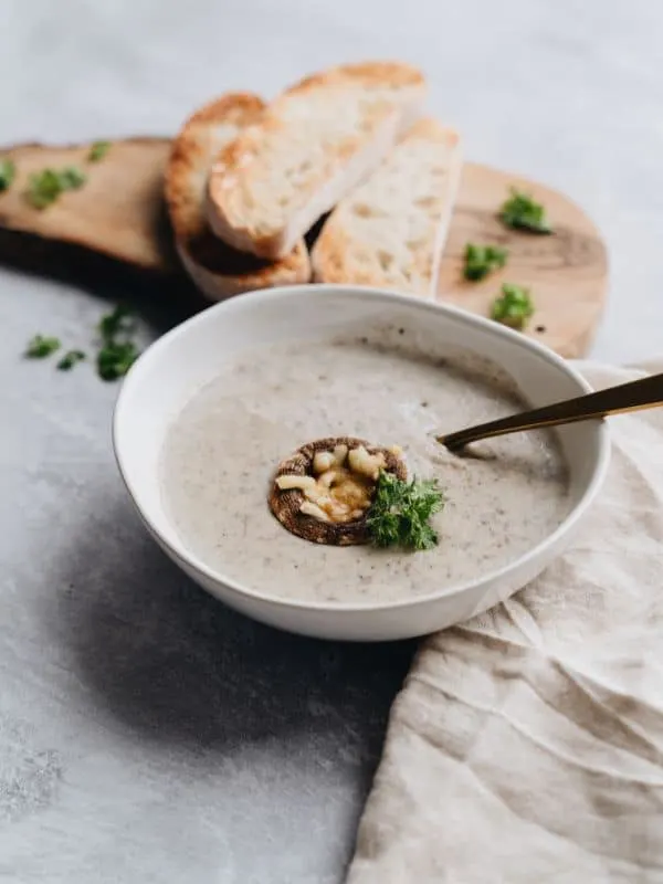 vegan chestnut soup in a bowl served with toast