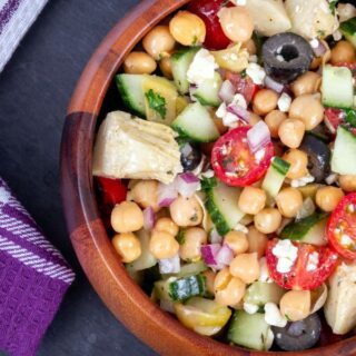 basic chickpea salad in a clay bowl