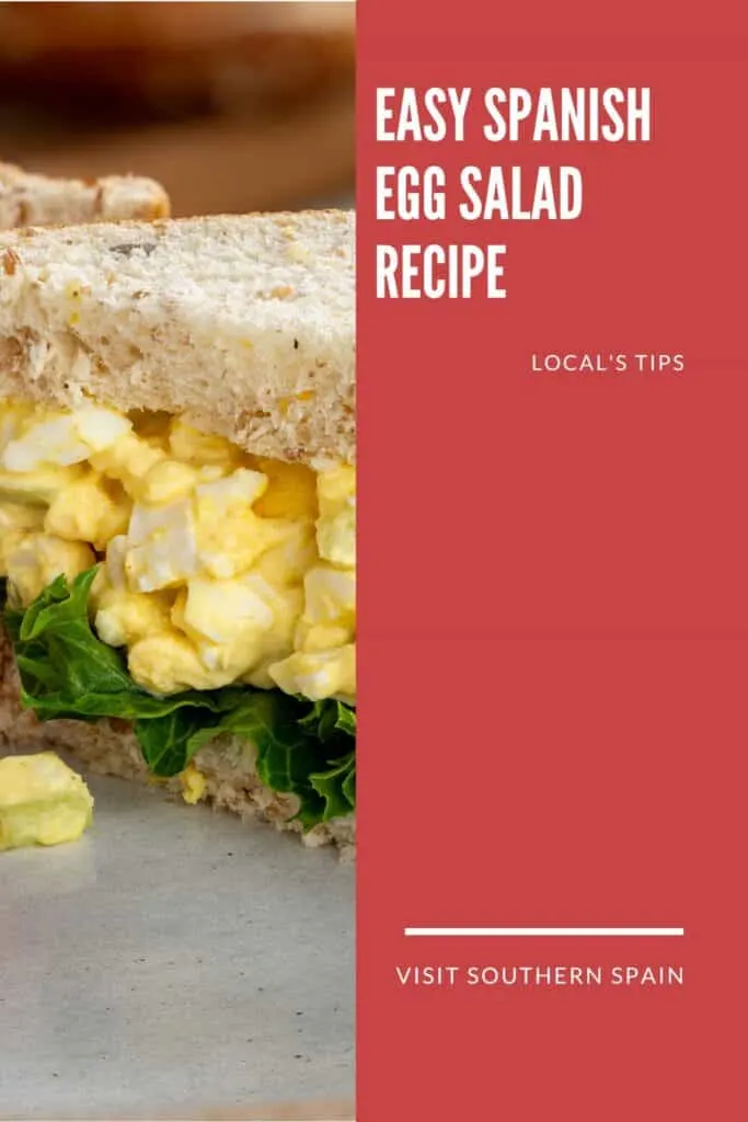 a pin with a sandwich made with Spanish Egg Salad