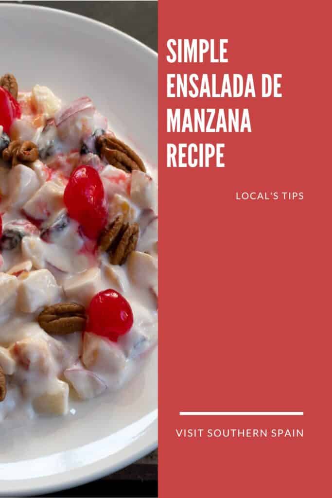 a pin with a ensalada de manzana topped with cherries.