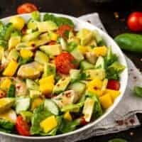 spanish avocado salad with tomatoes in a bowl