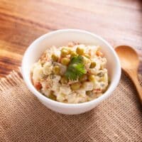 pineapple chicken salad in a bowl on a wooden table