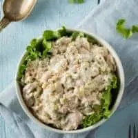 keto chicken salad recipe in a bowl on a blue table