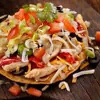 fajita chicken salad on a wooden board.