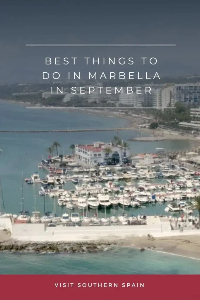 an aerial view of luxury boats docked on a port, with buildings