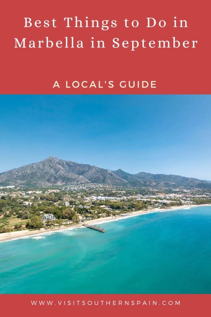 an aerial view of a beach, town, and mountain with the blue sea and sky