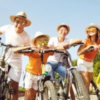 a family riding bicycles on a sunny day