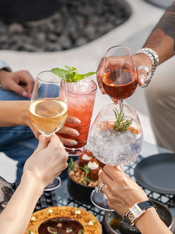 3 people with Best Spanish alcoholic drinks in their hands