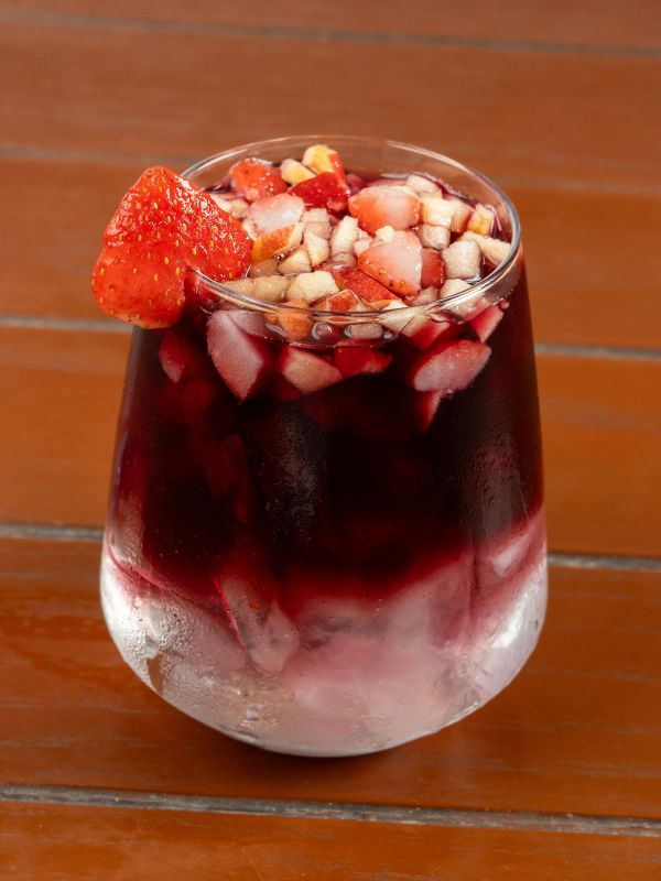 a glass of a fruity drink made with the summer sangria recipe with red wine, Best Spanish alcoholic drinks