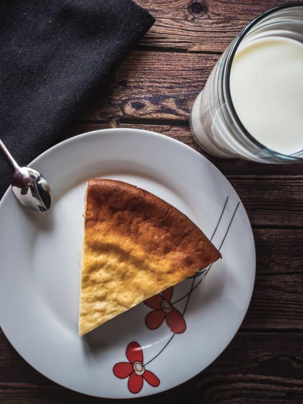 Quesada Pasiega a cheese dessert from Spain served with a glass of milk, classic spanish desserts