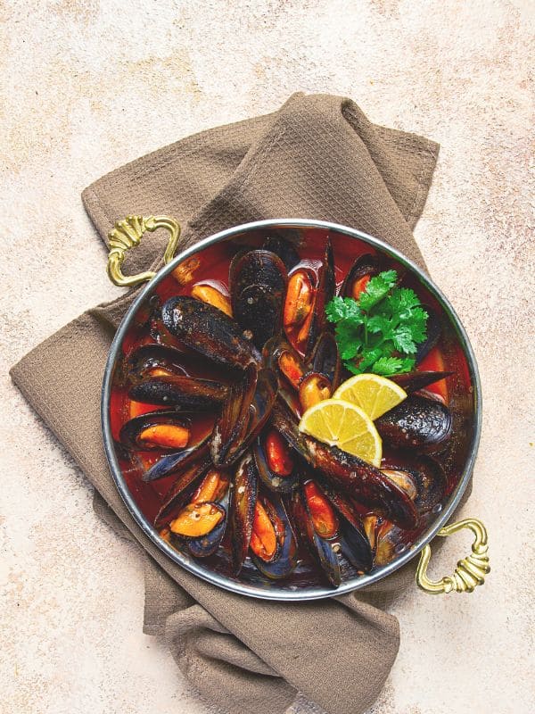 one of the Best Spanish starters, Mussels in tomato sauce in a pan