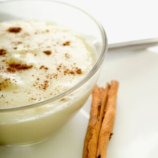 arroz con leche with coconut milk in a glass bowl