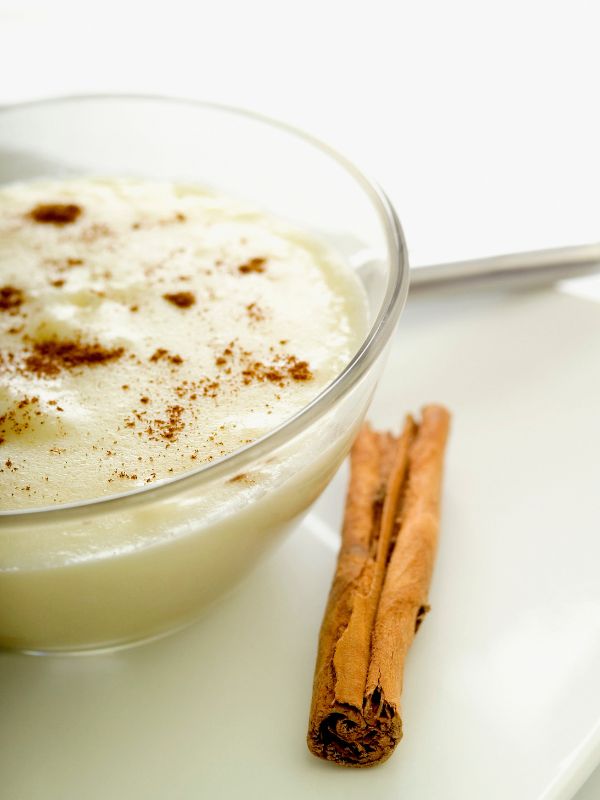 arroz con leche with coconut milk in a glass bowl