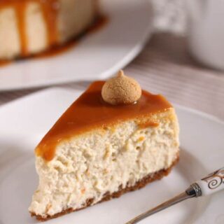 slice of dulce de leche cheesecake on a white plate