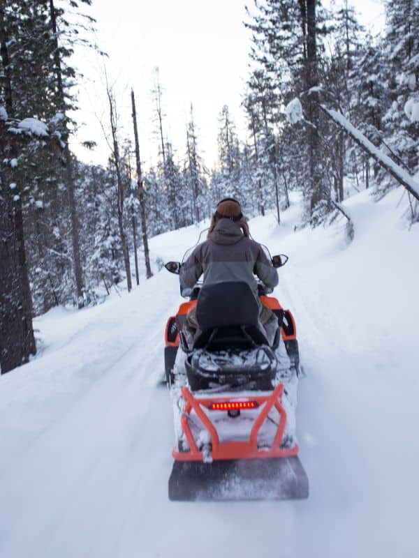 snowmobile ride in a snowy forest, Things to do in Sierra Nevada Ski Resort