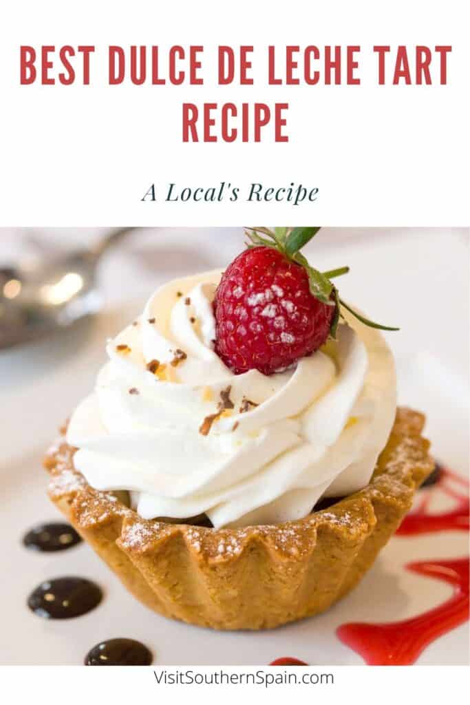a pin with a mini Dulce de leche tart decorated with raspberry.