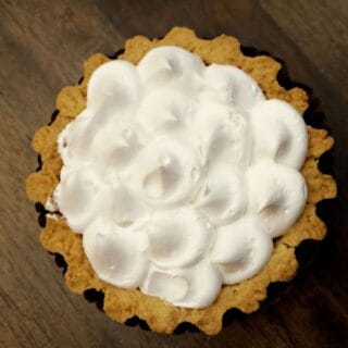 Dulce de leche tart decorated with whipped cream
