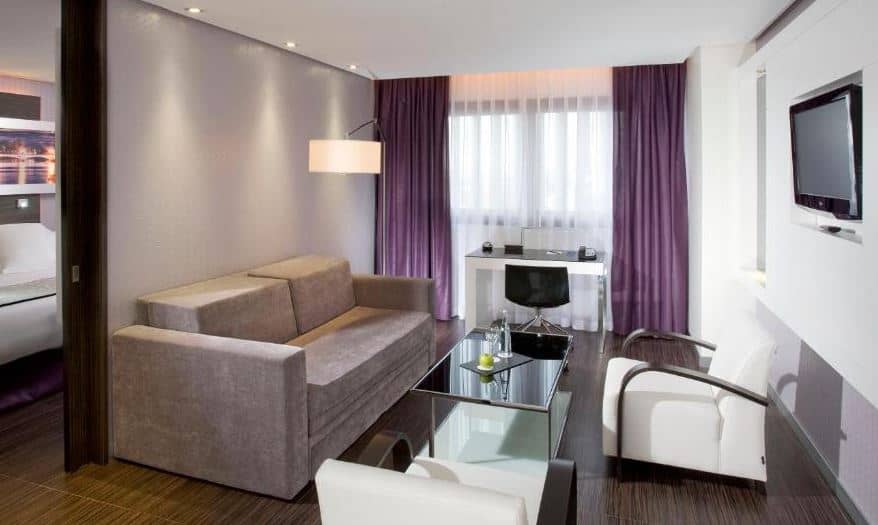 room with sofa at Meli&aacute; Lebreros in Seville